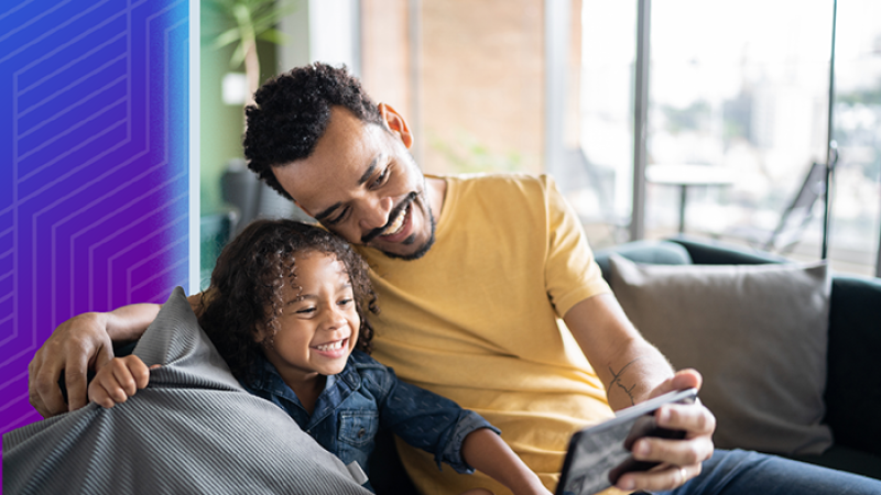 decorative photo: father and daughter looking at a phone