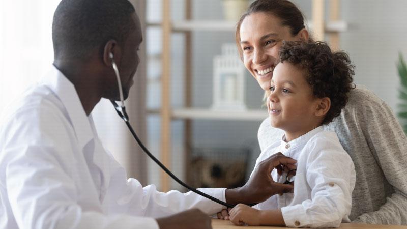 A mother with child and doctor at an appointment