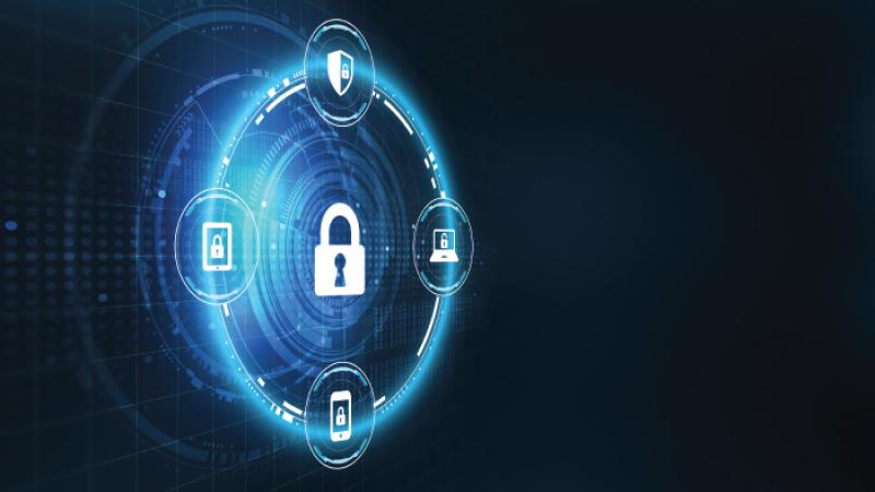 Encircled padlock with phone, shield, laptop, monitor figures containing padlock. 