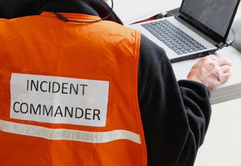 Image of a person with an incident commander title on their back