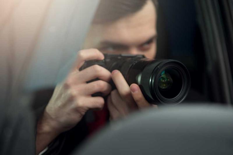 Image of a person with a camera taking a photo