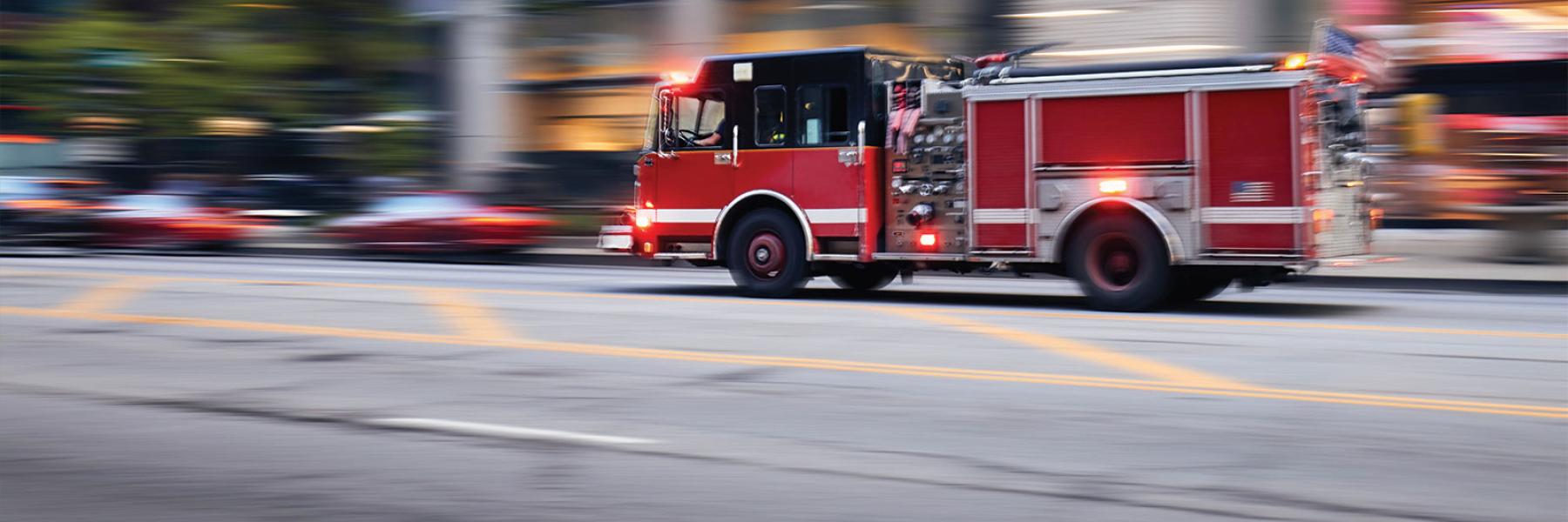 Fire truck rushing to an emergency in the city