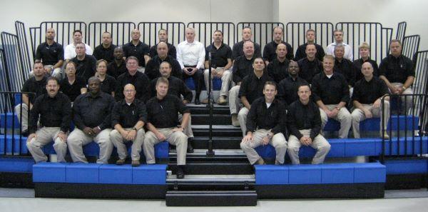 Original Chemical Security Inspector Cadre sitting on bleachers.