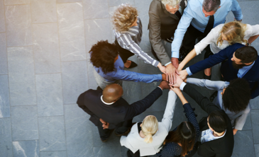 People's hands in a circle