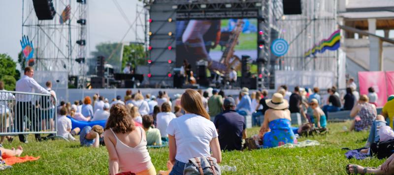 Image of the public gathered at a concert venue. 